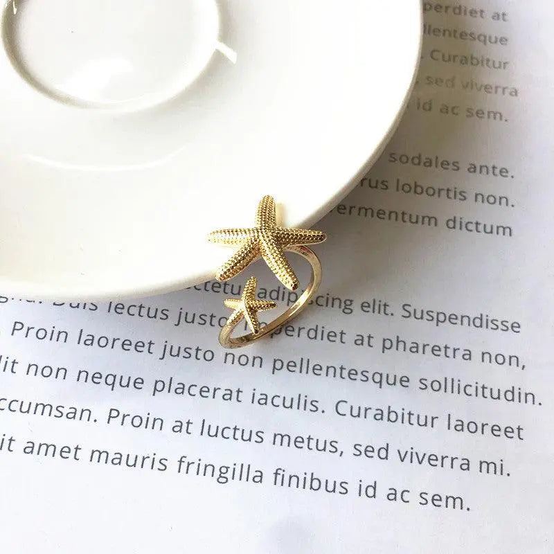 Justerbar Ring i Sølv og Guld | Med Delikat Søstjerne